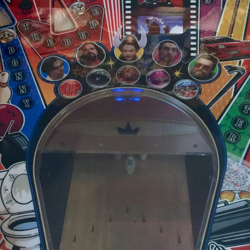 Themed bowling game board with character portraits and colorful design