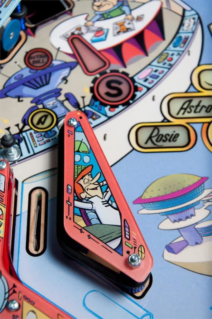 Colorful retro pinball machine with cartoon astronaut and space theme