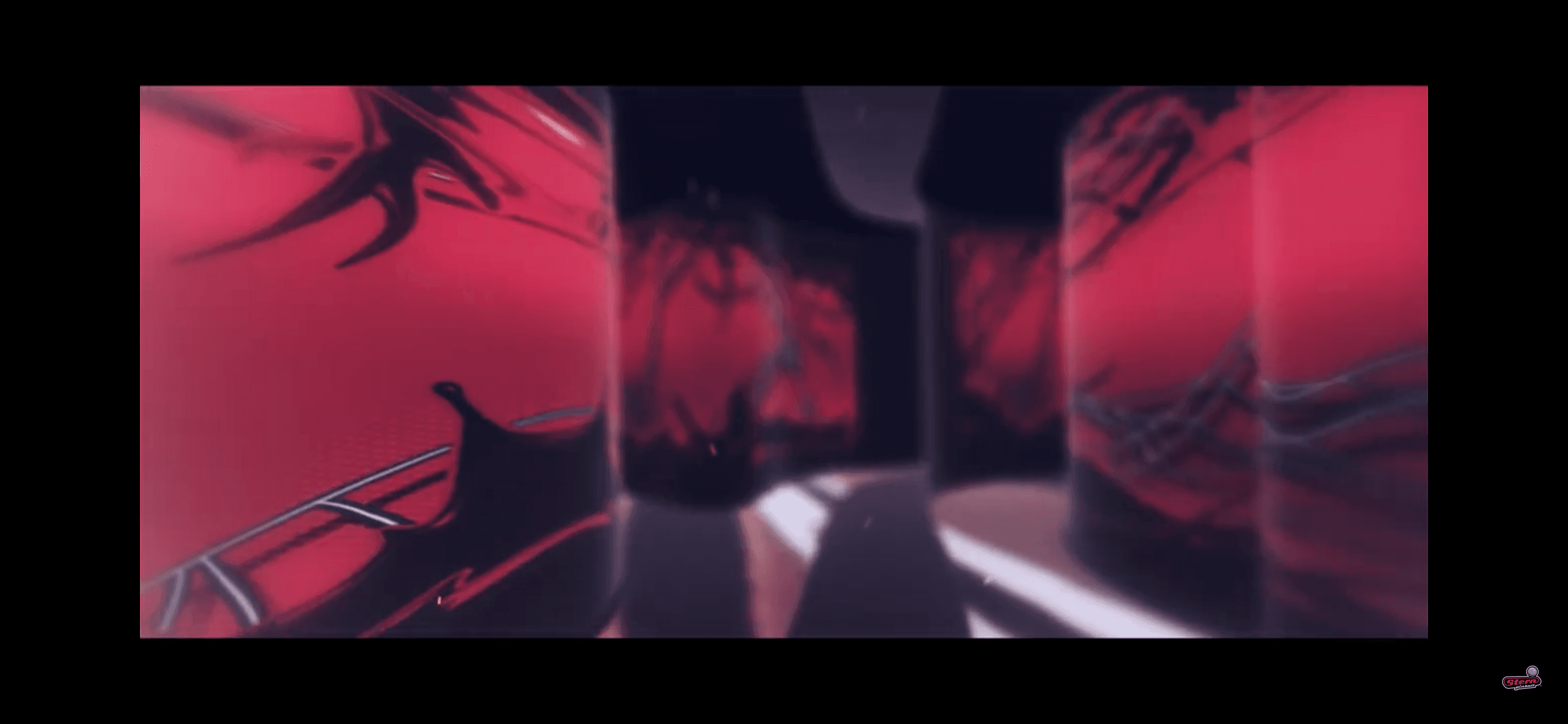 Blurred red and black abstract image with distorted reflective surfaces