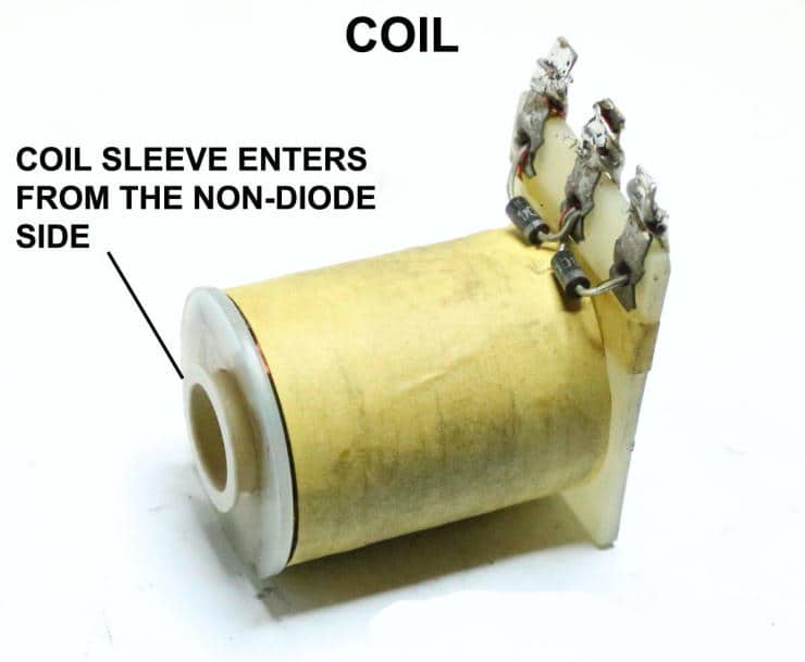 Yellow electrical coil with sleeve showing component details