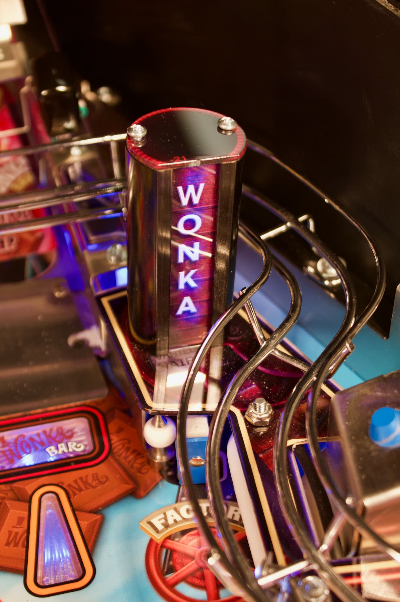 Wonka pinball machine with colorful illuminated display and metallic components