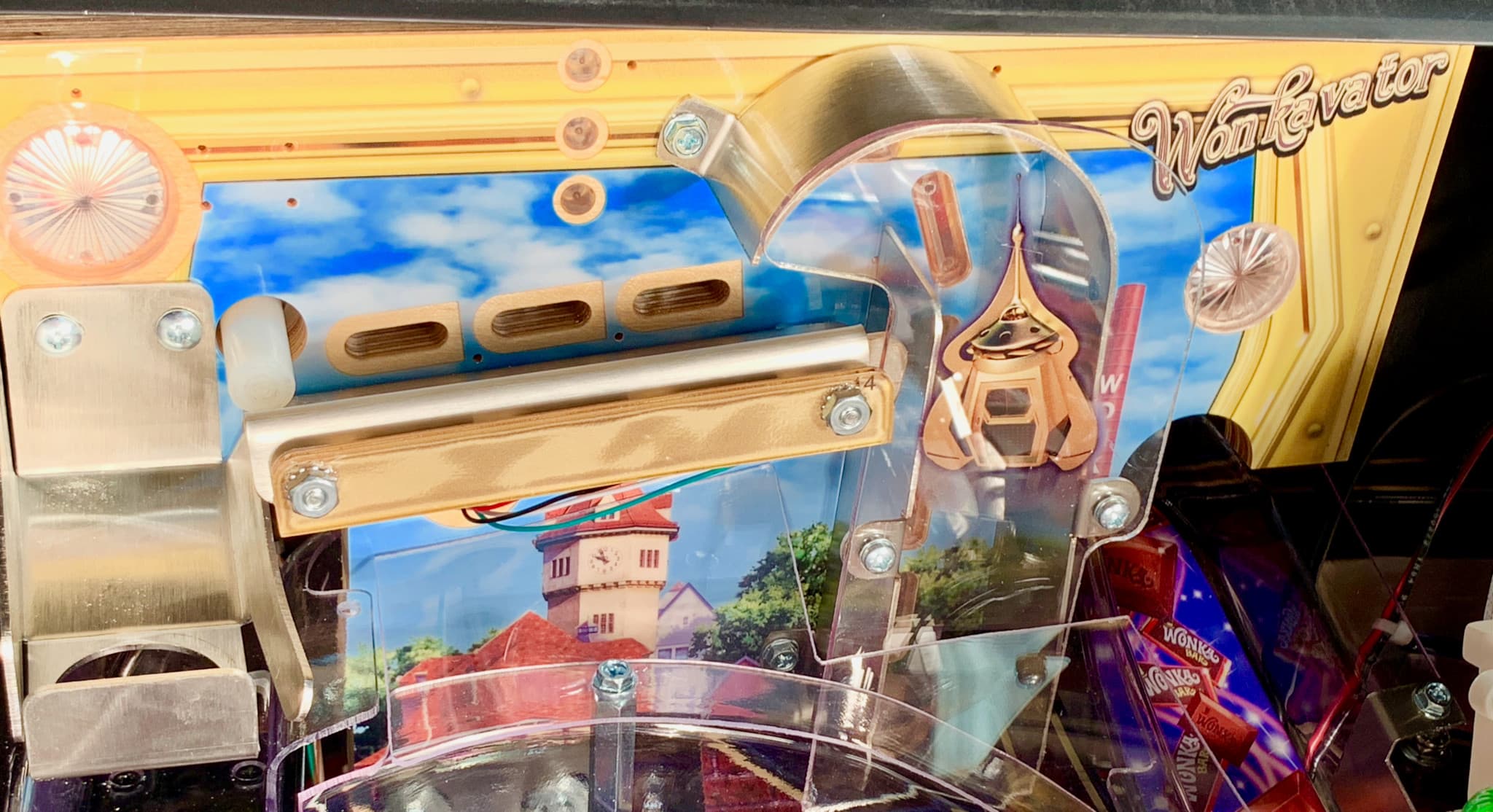 Wonkavator machine with mechanical parts and colorful background