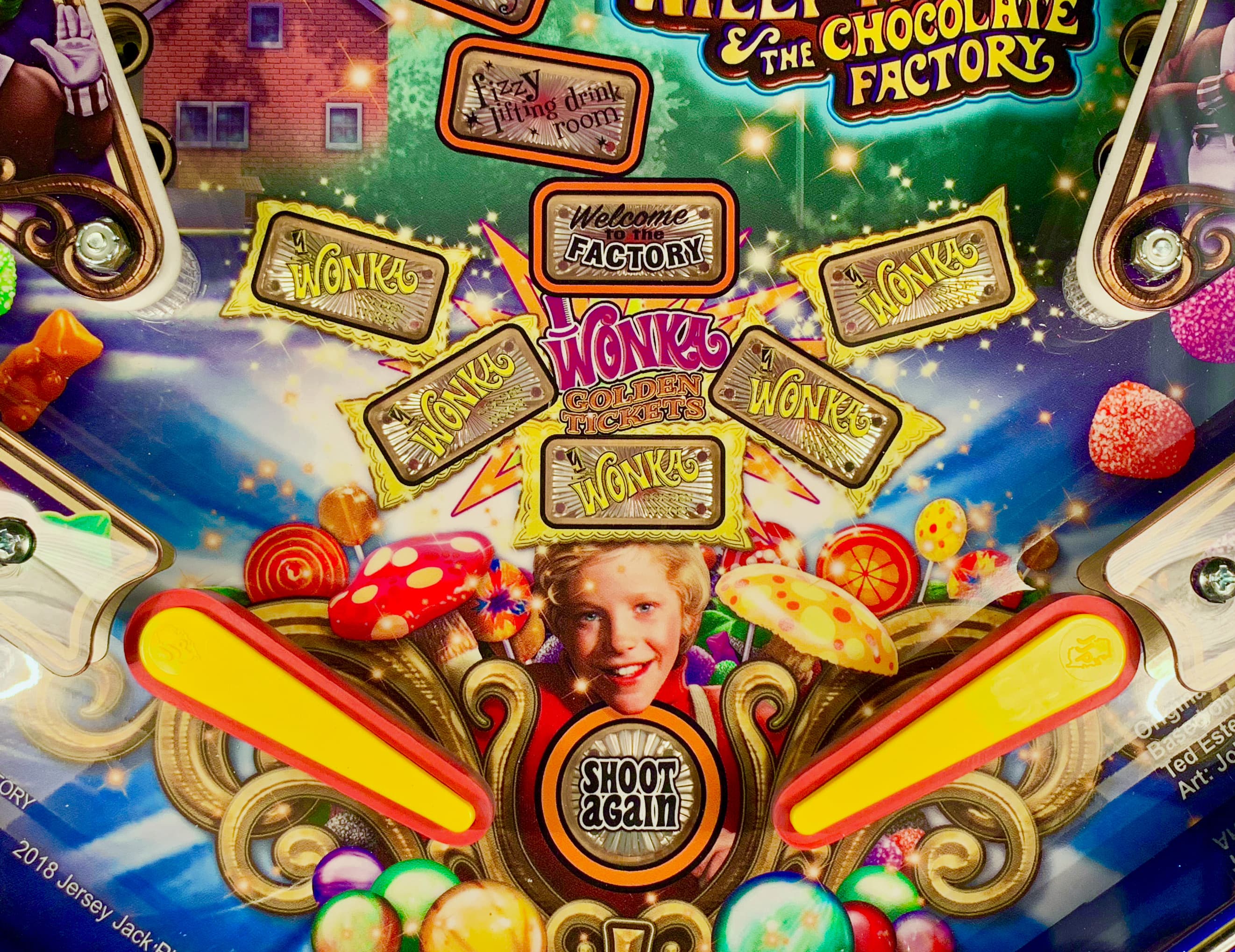 Willy Wonka pinball machine with golden tickets, candies, and colorful design
